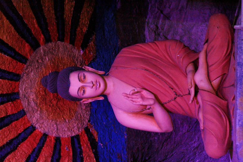 buddha statue in cave villa